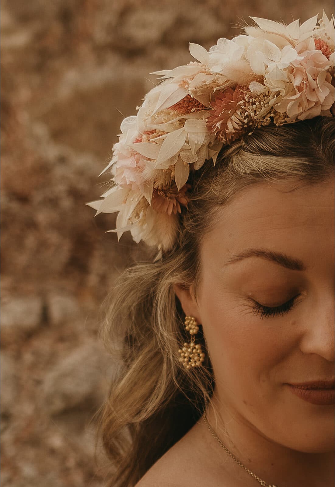Bride with a dried-flower crown, eyes closed